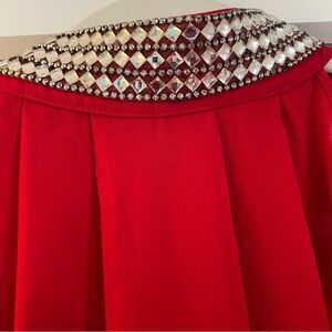 Red sleeveless crystal collared top